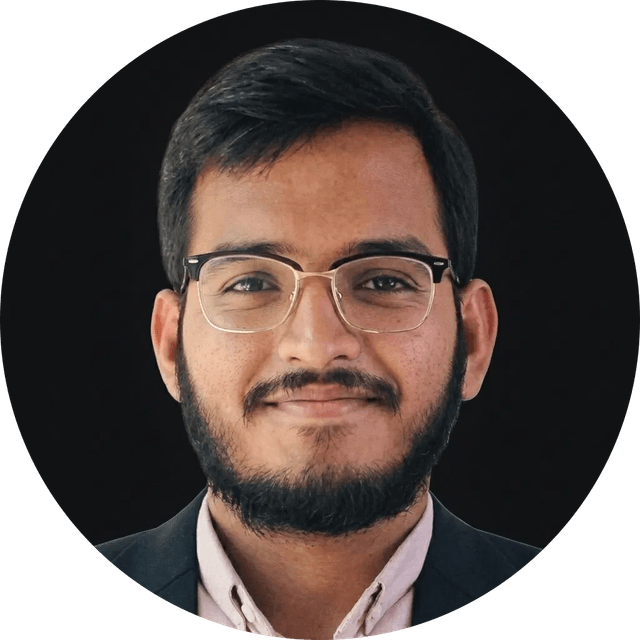 Muhammad Ausaf Jamal, smiling, in a dark blazer.